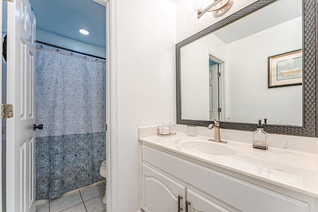 bathroom with tile patterned flooring, vanity, toilet, and a shower with curtain