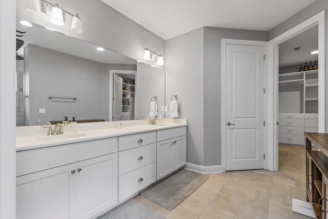 bathroom with tile patterned flooring and vanity