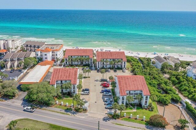 aerial view featuring a view of the beach and a water view