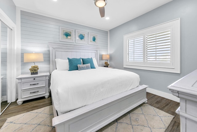 bedroom featuring ceiling fan and dark hardwood / wood-style flooring