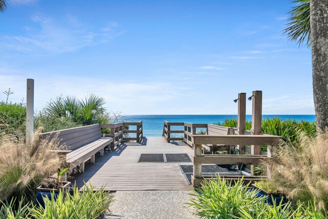 view of dock with a deck with water view