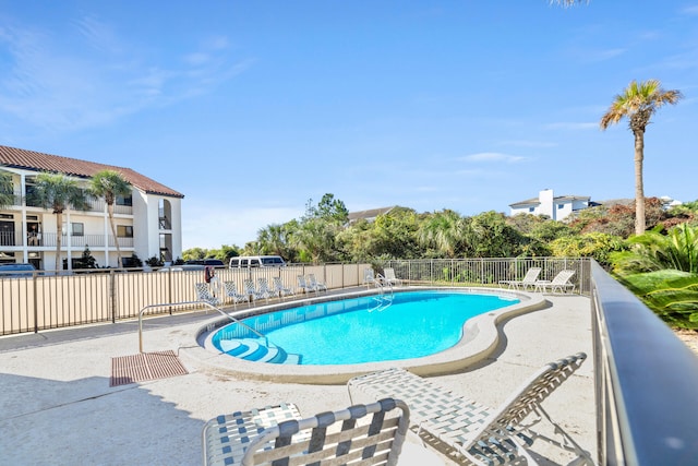 view of swimming pool with a patio