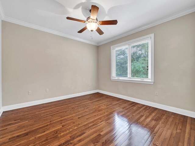 unfurnished room with dark hardwood / wood-style floors, ceiling fan, and crown molding