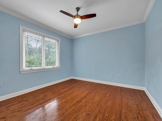 spare room featuring ceiling fan, wood-type flooring, and ornamental molding