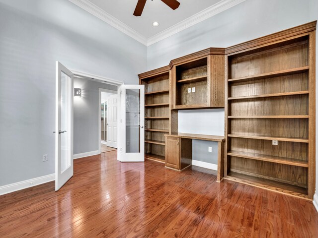 unfurnished living room with ceiling fan, french doors, wood-type flooring, and ornamental molding