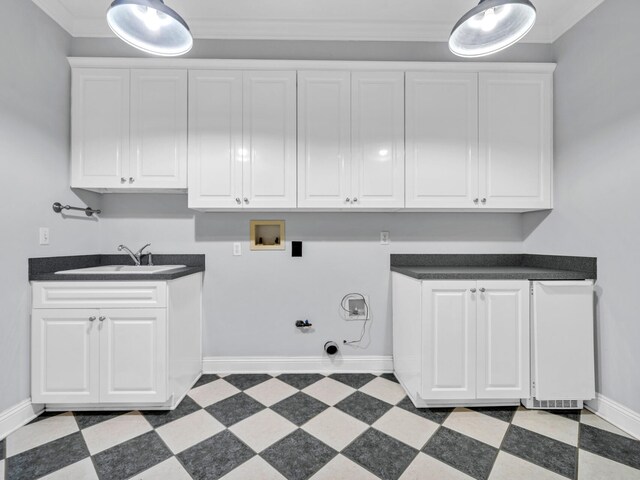 laundry room with sink, cabinets, gas dryer hookup, hookup for a washing machine, and ornamental molding