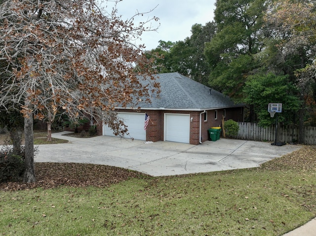 garage featuring a yard