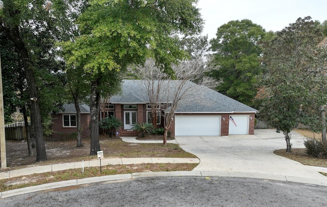 ranch-style house featuring a garage