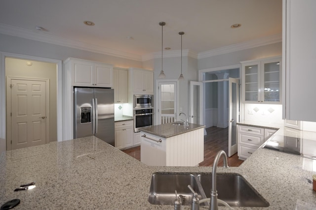 kitchen with dark hardwood / wood-style flooring, white cabinetry, a center island, and appliances with stainless steel finishes