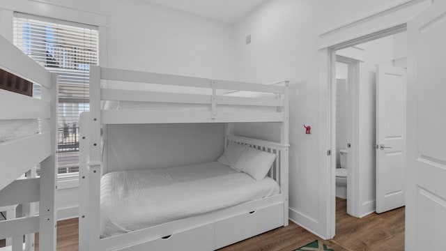 bedroom with wood-type flooring