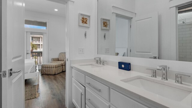 55 Nature Way Unit 100-1, Santa Rosa Beach, FL 32459 - full bathroom with ensuite bathroom, wood finished floors, double vanity, and recessed lighting