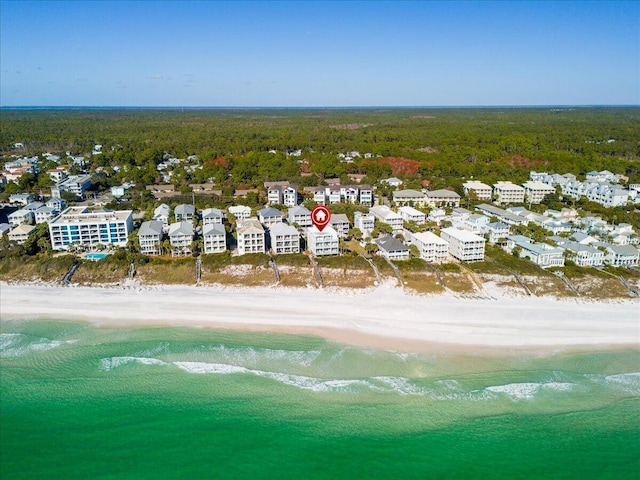 birds eye view of property featuring a view of the beach and a water view