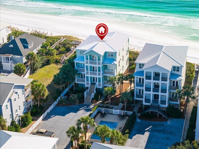 birds eye view of property with a view of the beach and a water view