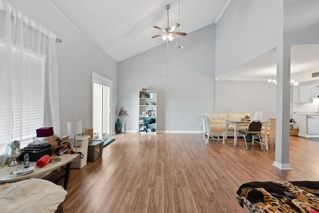 1840 E Mallard Dr Apt C, Panama City, FL 32404 - living room with high vaulted ceiling, visible vents, baseboards, a ceiling fan, and light wood-style floors