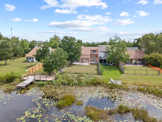 birds eye view of property featuring a water view