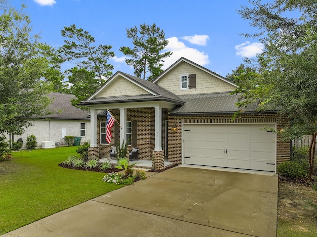 view of front of house featuring a garage and a front lawn