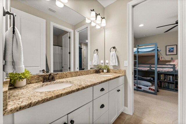 bathroom with vanity, a shower with curtain, ceiling fan, and tile patterned flooring