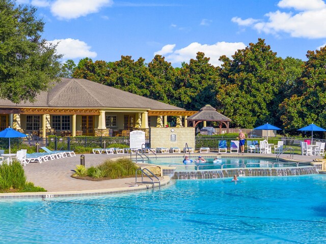 view of pool featuring a patio and pool water feature