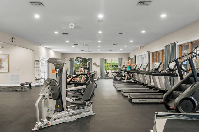 exercise room with ceiling fan