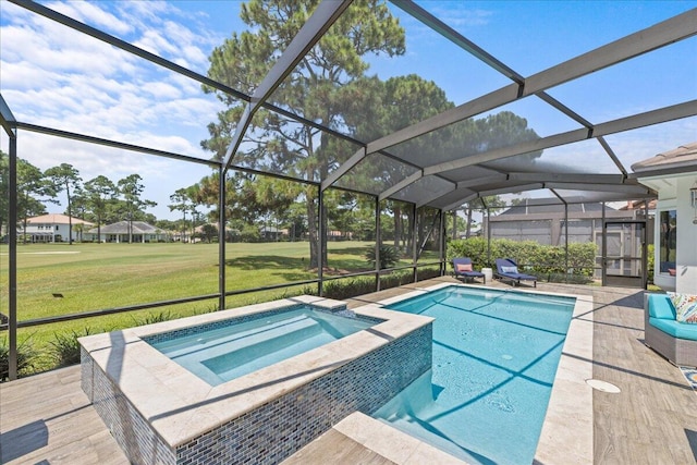 view of pool featuring a lanai, an in ground hot tub, a patio area, and a yard