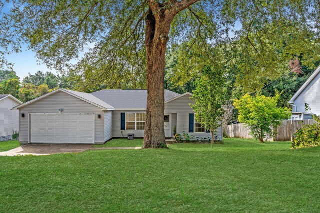 single story home with a garage and a front lawn