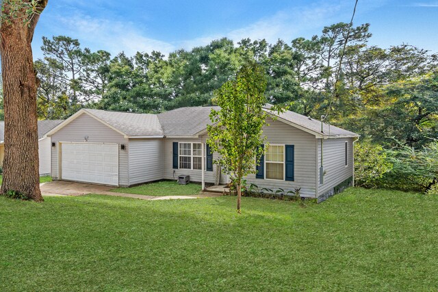 view of front facade featuring a garage and a front lawn