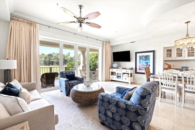 living room featuring light tile patterned floors, ceiling fan with notable chandelier, and ornamental molding