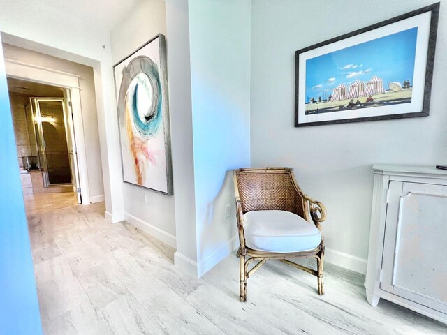 sitting room with light hardwood / wood-style floors