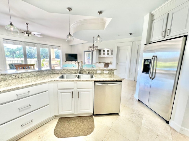 kitchen with pendant lighting, white cabinetry, sink, and appliances with stainless steel finishes