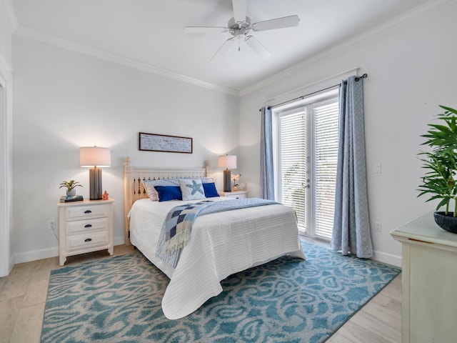 bedroom with light hardwood / wood-style flooring, ceiling fan, and ornamental molding