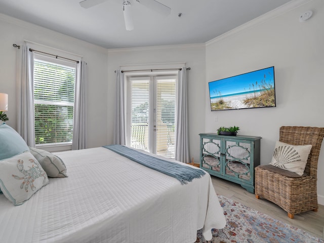 bedroom featuring multiple windows, ceiling fan, light hardwood / wood-style flooring, and ornamental molding