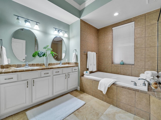 bathroom with vanity, tile patterned floors, ornamental molding, tile walls, and tiled bath