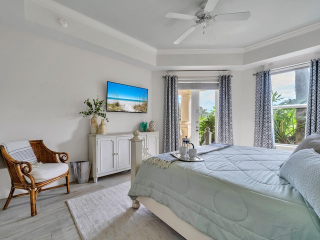 bedroom featuring access to outside, light wood-style flooring, a ceiling fan, and ornamental molding