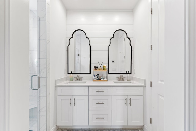 bathroom featuring vanity, wood walls, and walk in shower