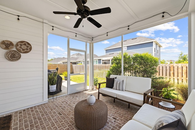 sunroom / solarium with ceiling fan