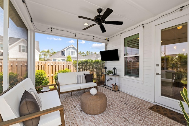 sunroom / solarium with ceiling fan