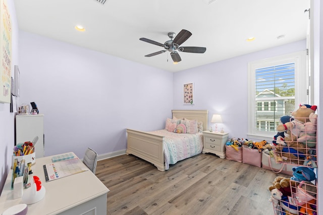 bedroom featuring ceiling fan and light hardwood / wood-style floors