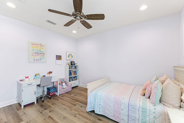 bedroom with ceiling fan and light wood-type flooring