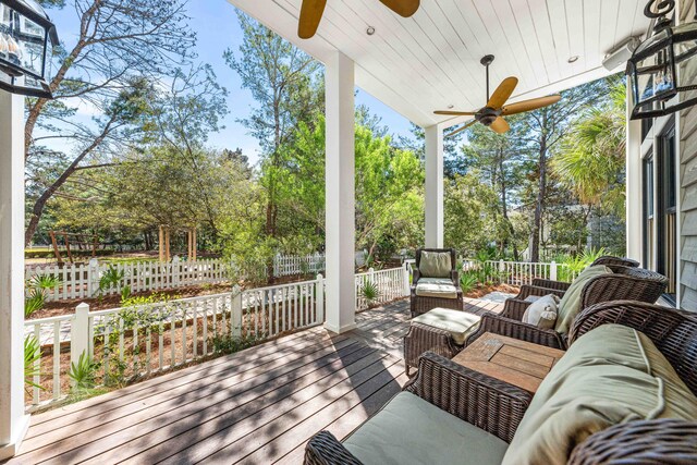 wooden deck featuring ceiling fan and an outdoor hangout area