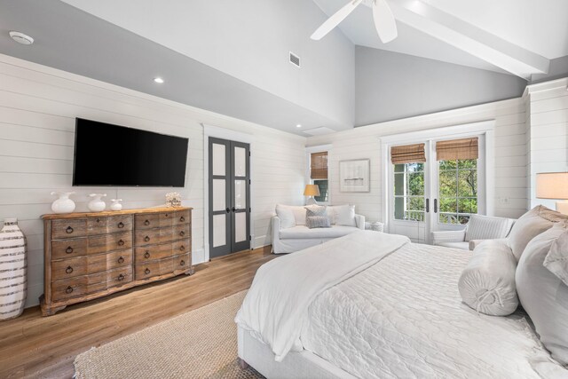 bedroom featuring lofted ceiling, french doors, ceiling fan, and hardwood / wood-style flooring