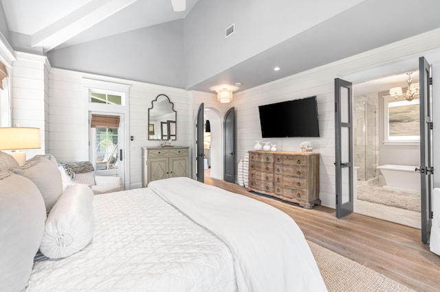 bedroom featuring multiple windows, light hardwood / wood-style floors, lofted ceiling with beams, and french doors