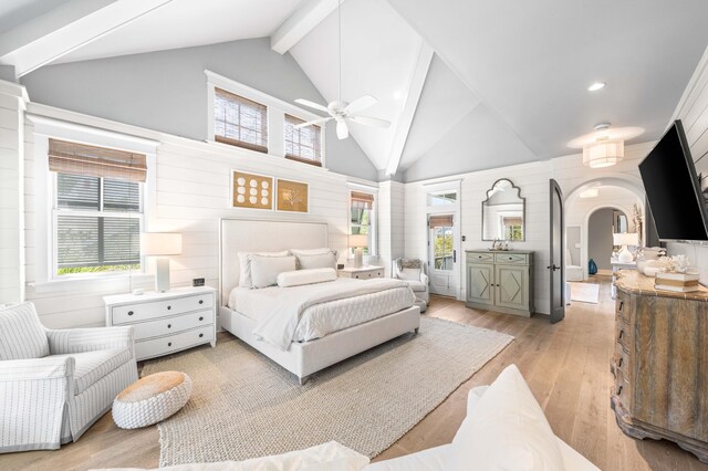 bedroom with multiple windows, beamed ceiling, and ceiling fan