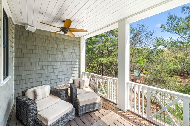 exterior space featuring outdoor lounge area and ceiling fan