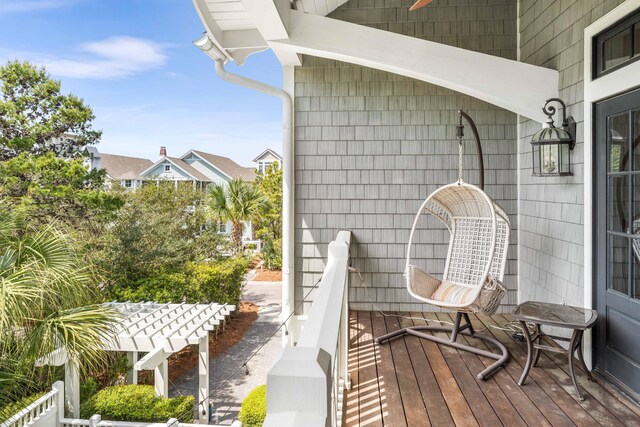 balcony featuring a pergola