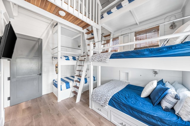 bedroom with hardwood / wood-style flooring