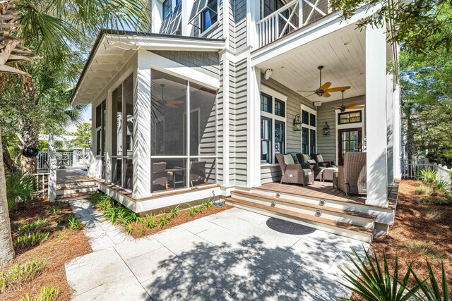 exterior space featuring ceiling fan, a patio, and a sunroom