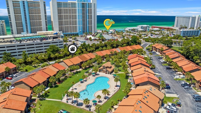 birds eye view of property with a water view