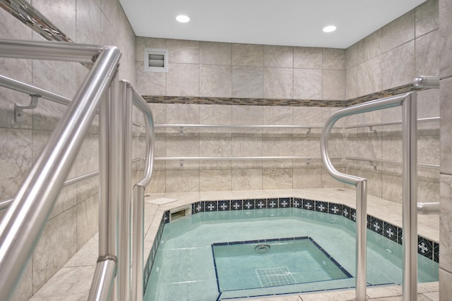 view of swimming pool featuring an indoor in ground hot tub