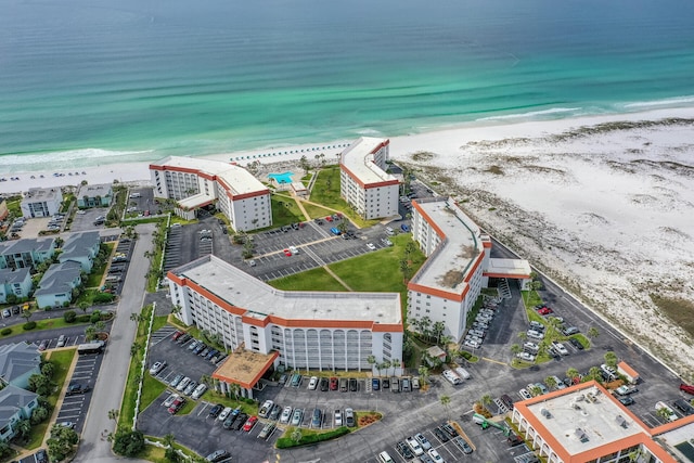 birds eye view of property with a view of the beach and a water view