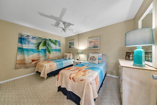 bedroom featuring a textured ceiling, carpet, and ceiling fan